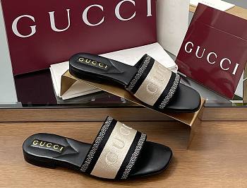 gucci Women's slide sandal with Black and white cotton canvas